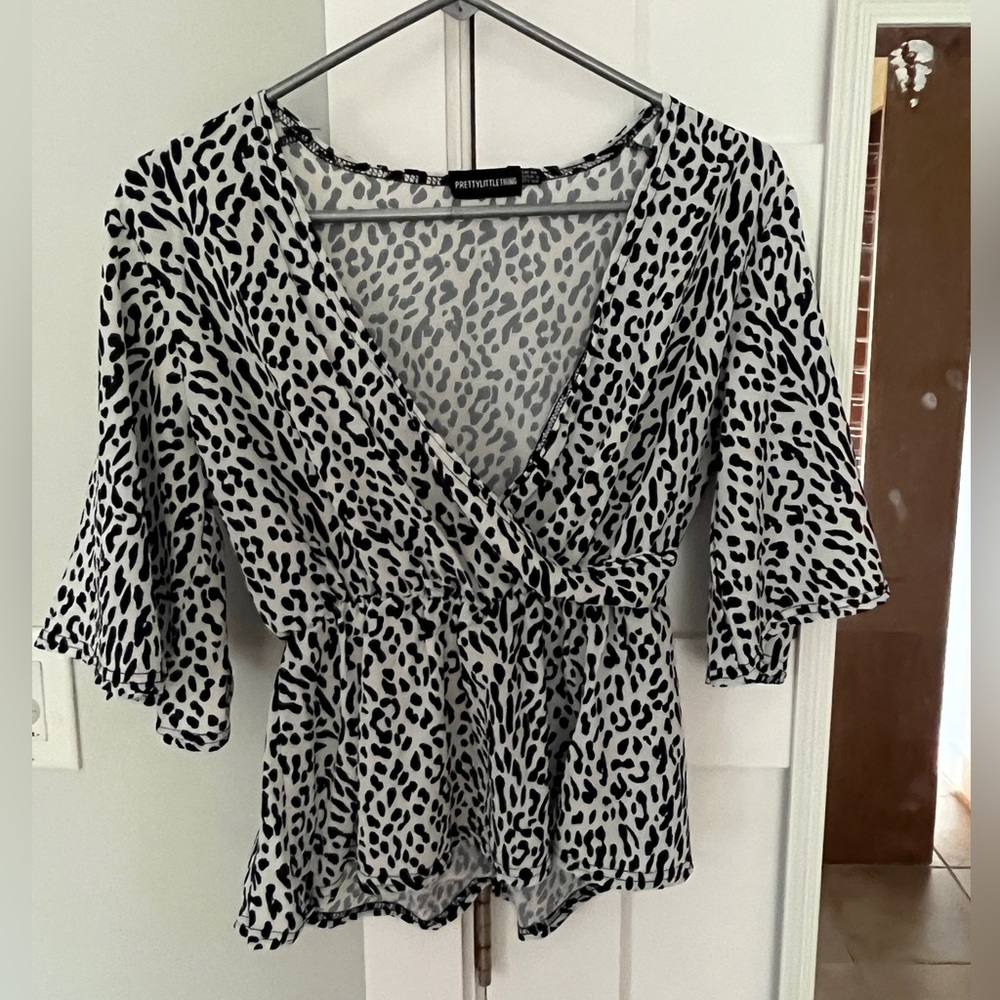 Leopard print black and white peplum top